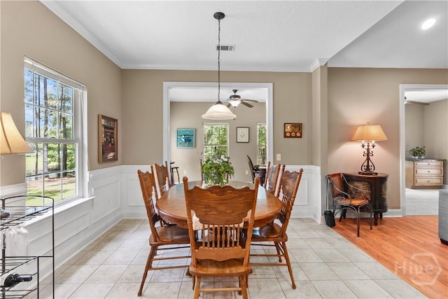 287 Sandpiper Rd, Midway, GA 31320 - dining area featuring light tile patterned floors, ceiling fan, and ornamental molding