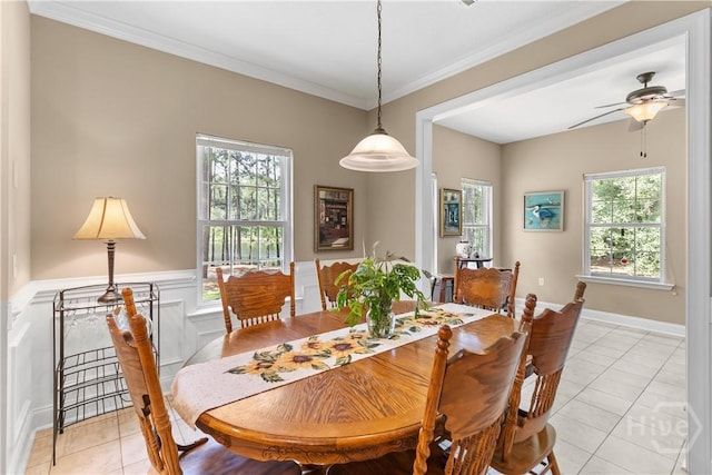 287 Sandpiper Rd, Midway, GA 31320 - dining area with light tile patterned flooring, ceiling fan, and crown molding