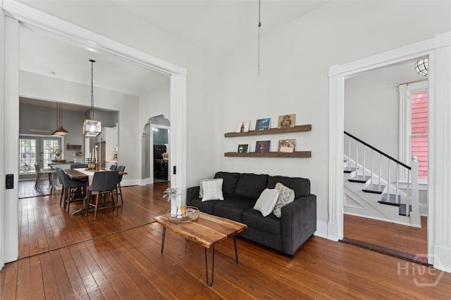 2309 Whitaker St, Savannah, GA 31401 - living area featuring hardwood / wood-style floors, arched walkways, and stairway