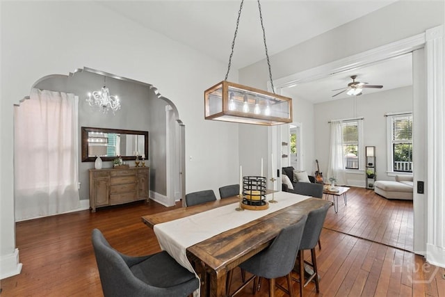 2309 Whitaker St, Savannah, GA 31401 - dining area with arched walkways, hardwood / wood-style flooring, a ceiling fan, and a chandelier