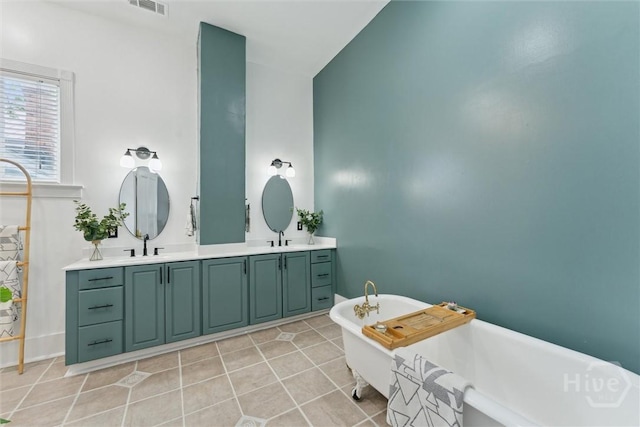2309 Whitaker St, Savannah, GA 31401 - bathroom featuring double vanity, a soaking tub, and tile patterned floors