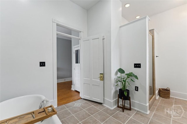 2309 Whitaker St, Savannah, GA 31401 - bathroom with a soaking tub, tile patterned floors, recessed lighting, and a stall shower