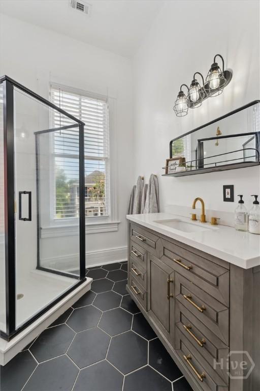 2309 Whitaker St, Savannah, GA 31401 - bathroom featuring vanity, a shower stall, and tile patterned floors