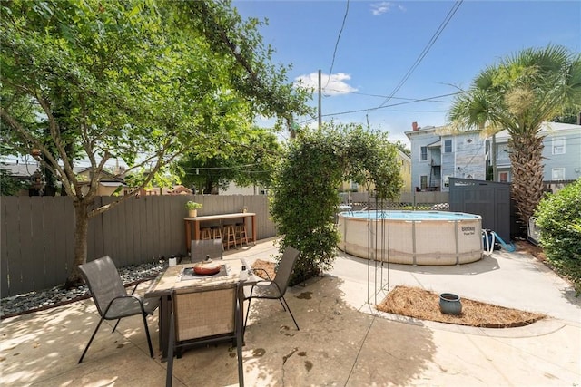 2309 Whitaker St, Savannah, GA 31401 - fenced backyard with outdoor dining space and a patio