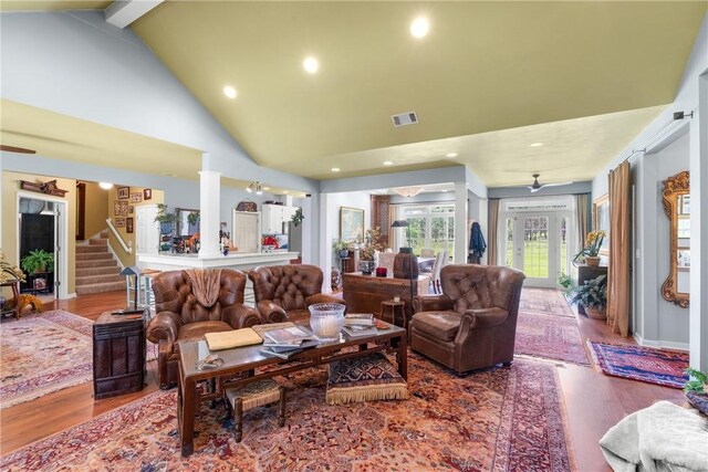 2441 Bovine Rd, Sylvania, GA 30467 - living area with wood finished floors, stairs, recessed lighting, high vaulted ceiling, and beam ceiling
