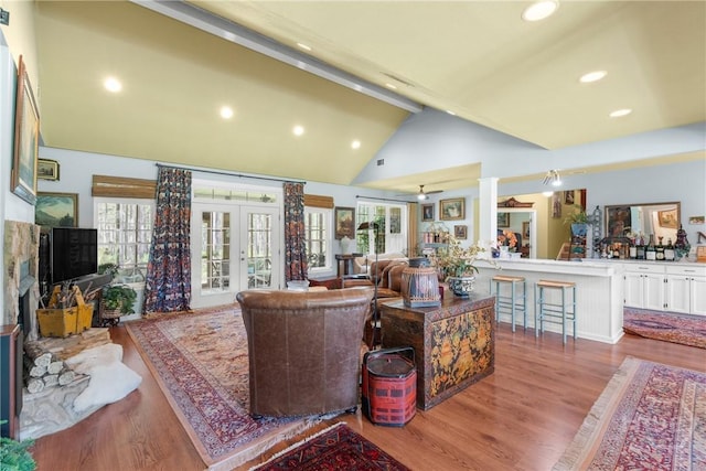 2441 Bovine Rd, Sylvania, GA 30467 - living area with wood finished floors, beamed ceiling, french doors, recessed lighting, and high vaulted ceiling