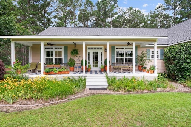 2441 Bovine Rd, Sylvania, GA 30467 - view of front of property with a ceiling fan, covered porch, a front lawn, and a shingled roof