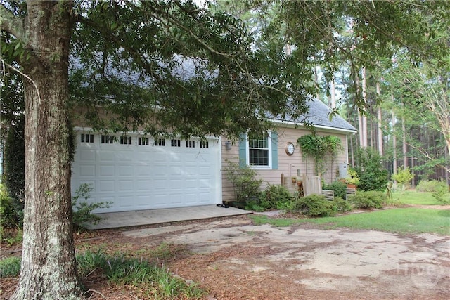 2441 Bovine Rd, Sylvania, GA 30467 - view of front of property featuring driveway, a garage, and a shingled roof