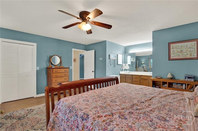 119 Catalina Dr, Tybee Island, GA 31328 - bedroom featuring wood finished floors, ensuite bathroom, and ceiling fan