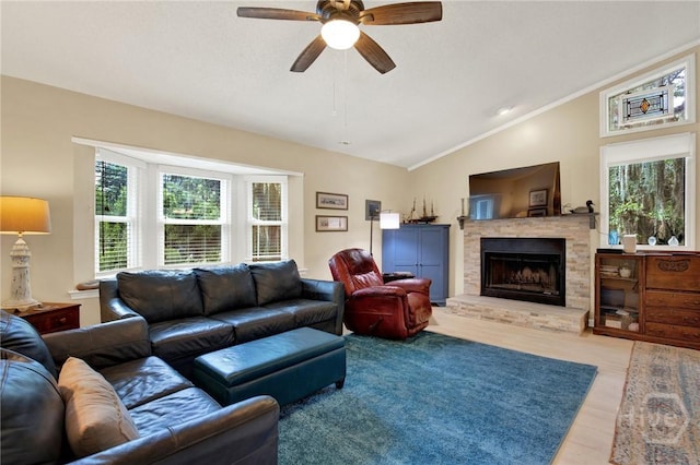119 Catalina Dr, Tybee Island, GA 31328 - living area with lofted ceiling, a fireplace, wood finished floors, ceiling fan, and crown molding