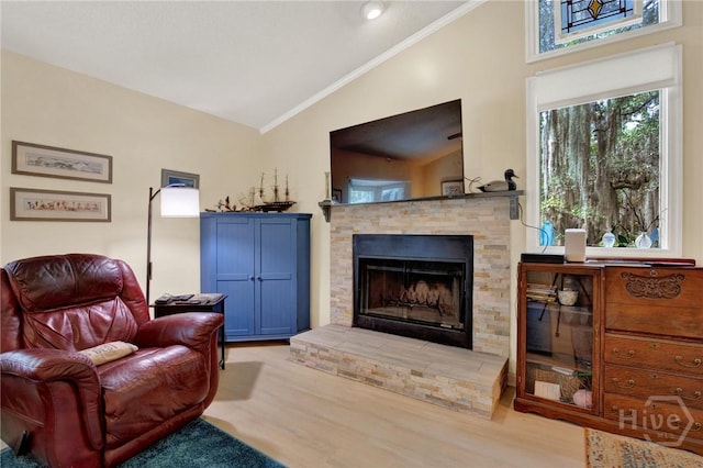 119 Catalina Dr, Tybee Island, GA 31328 - living room with lofted ceiling, crown molding, wood finished floors, and a fireplace
