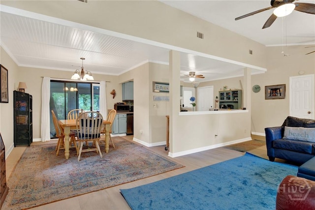 119 Catalina Dr, Tybee Island, GA 31328 - living area with ceiling fan, light wood-style floors, a chandelier, and crown molding
