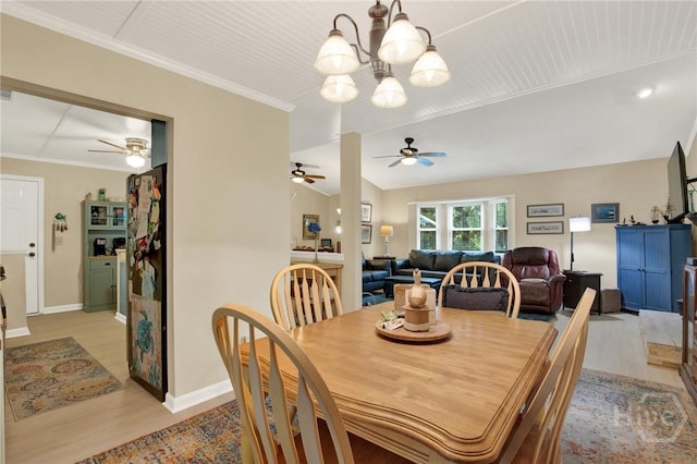 119 Catalina Dr, Tybee Island, GA 31328 - dining space featuring light wood finished floors, a ceiling fan, a chandelier, and ornamental molding