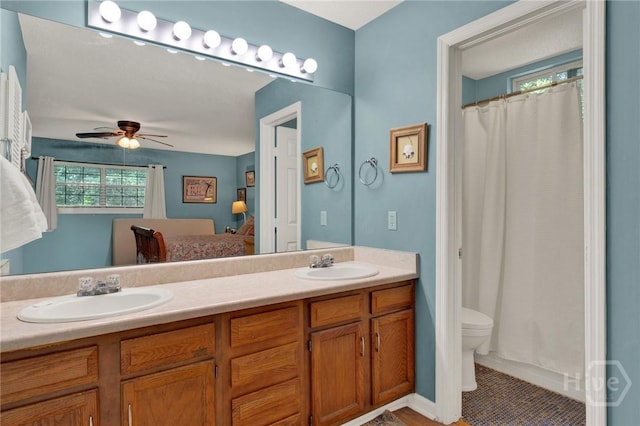 119 Catalina Dr, Tybee Island, GA 31328 - ensuite bathroom featuring double vanity, a ceiling fan, tile patterned floors, and a shower with shower curtain