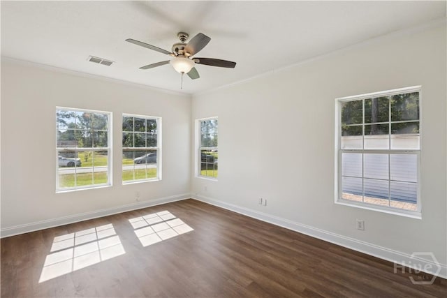 25 SE Cutters Gap, Ludowici, GA 31316 - spare room featuring dark wood-style floors, a ceiling fan, and crown molding