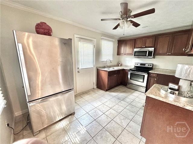 2210 Mosley St, Savannah, GA 31404 - kitchen with stainless steel appliances, light tile patterned floors, ornamental molding, and ceiling fan