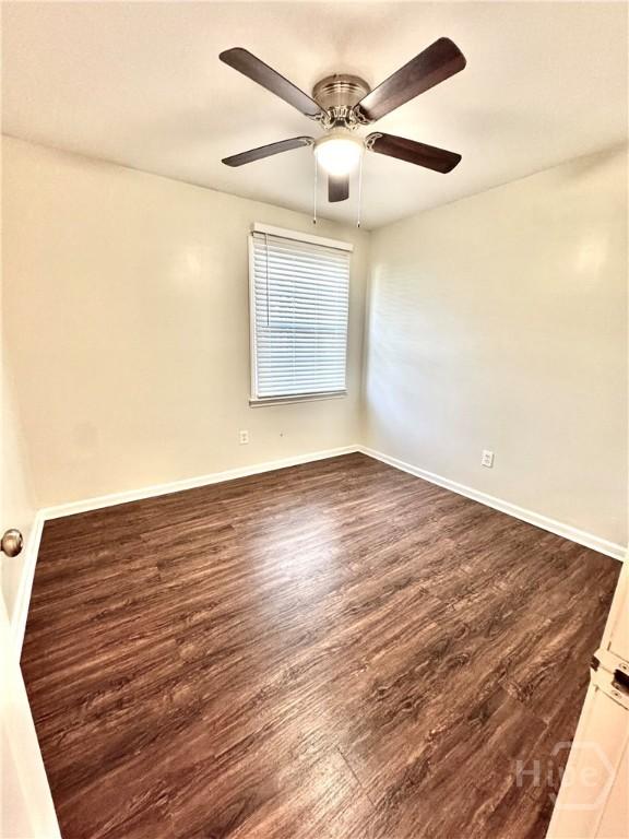 2210 Mosley St, Savannah, GA 31404 - spare room featuring dark wood-style flooring and ceiling fan