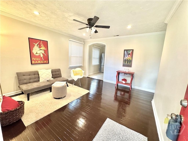 2210 Mosley St, Savannah, GA 31404 - living room featuring arched walkways, hardwood / wood-style floors, crown molding, a ceiling fan, and recessed lighting
