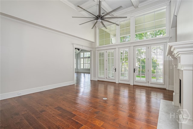 83 Waterway Dr, Savannah, GA 31411 - unfurnished living room featuring a ceiling fan, a high ceiling, coffered ceiling, wood-type flooring, and beam ceiling