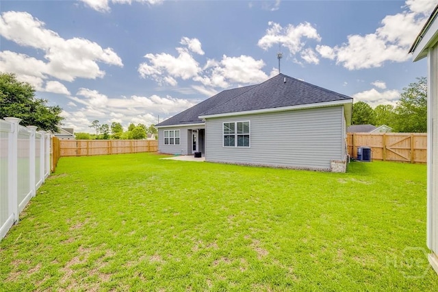 106 Cobbleton Dr, Rincon, GA 31326 - back of property with a fenced backyard and a shingled roof