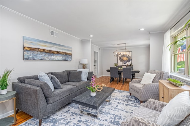 397 Hunt Dr, Savannah, GA 31406 - living room with a chandelier, wood finished floors, recessed lighting, and crown molding