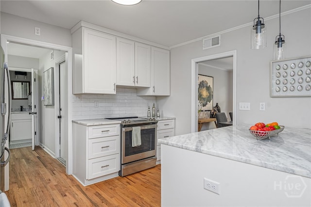 397 Hunt Dr, Savannah, GA 31406 - kitchen with stainless steel electric stove, white cabinetry, decorative backsplash, light wood-style floors, and crown molding