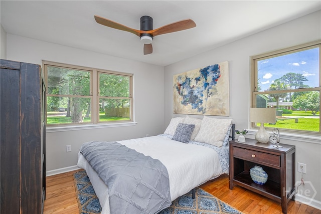 397 Hunt Dr, Savannah, GA 31406 - bedroom featuring multiple windows, wood finished floors, and ceiling fan