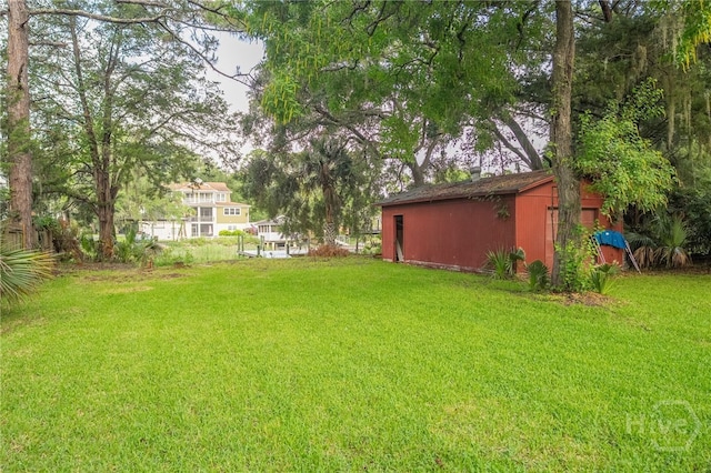 397 Hunt Dr, Savannah, GA 31406 - view of green lawn featuring an outbuilding and a pole building