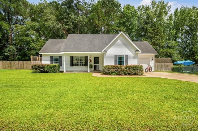 275 Carter St, Richmond Hill, GA 31324 - view of front of house featuring concrete driveway, a garage, and view of wooded area