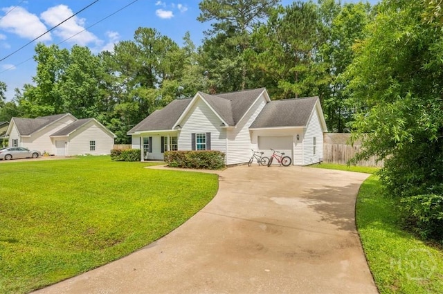 275 Carter St, Richmond Hill, GA 31324 - view of front of home featuring concrete driveway, an attached garage, and view of wooded area