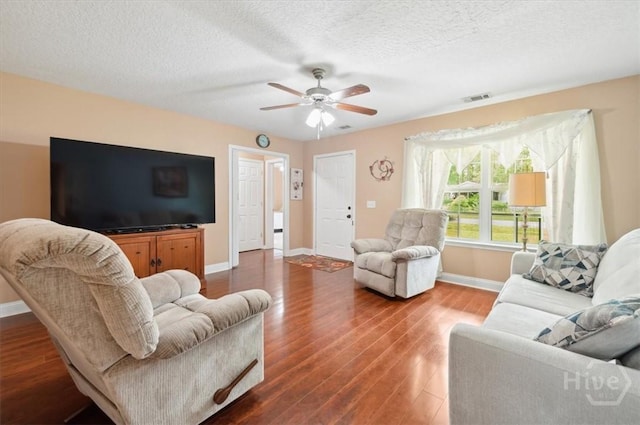 275 Carter St, Richmond Hill, GA 31324 - living room with ceiling fan, wood finished floors, and a textured ceiling