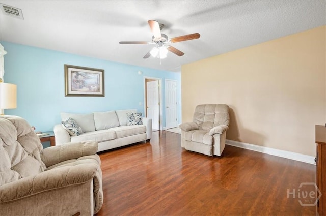 275 Carter St, Richmond Hill, GA 31324 - living area featuring a ceiling fan and dark wood-style floors