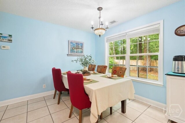 275 Carter St, Richmond Hill, GA 31324 - dining space with light tile patterned floors and a chandelier