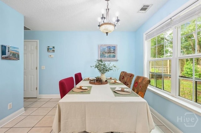 275 Carter St, Richmond Hill, GA 31324 - dining area featuring light tile patterned floors and a textured ceiling