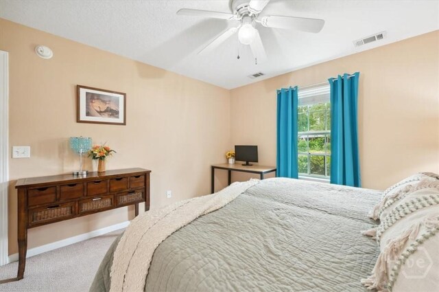 275 Carter St, Richmond Hill, GA 31324 - carpeted bedroom with a ceiling fan and baseboards