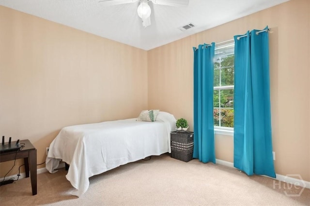 275 Carter St, Richmond Hill, GA 31324 - carpeted bedroom featuring multiple windows and ceiling fan