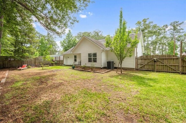 275 Carter St, Richmond Hill, GA 31324 - back of property with a fenced backyard and a gate