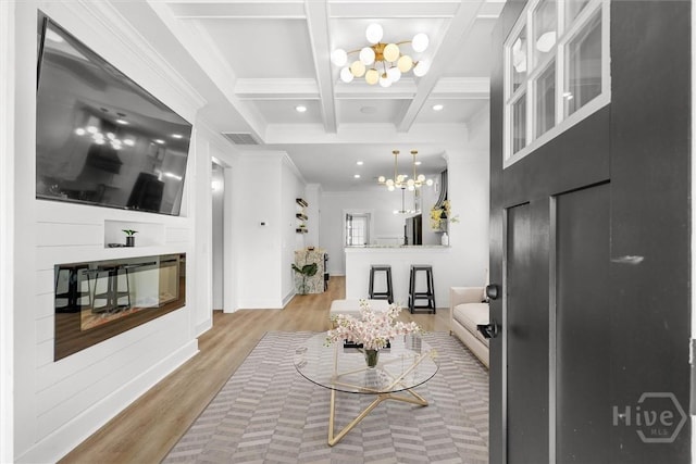 1212 Seiler Ave, Savannah, GA 31404 - living room with a chandelier, coffered ceiling, wood finished floors, beam ceiling, and crown molding