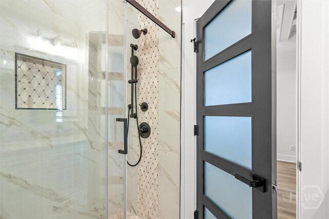 1212 Seiler Ave, Savannah, GA 31404 - bathroom with a marble finish shower and wood finished floors