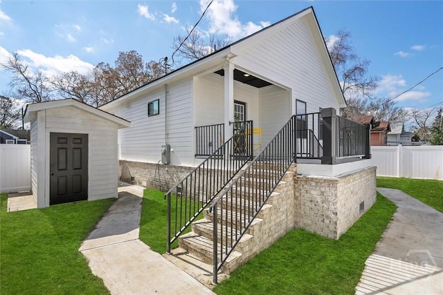 1212 Seiler Ave, Savannah, GA 31404 - view of front facade with a storage shed and stairway