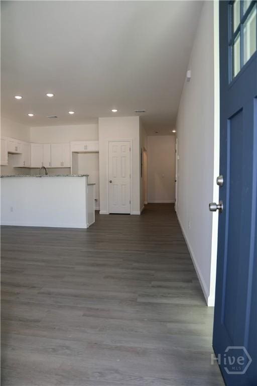 238 Millen St, Savannah, GA 31415 - unfurnished living room with dark wood-type flooring and recessed lighting
