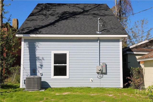 238 Millen St, Savannah, GA 31415 - view of property exterior with a shingled roof and a yard