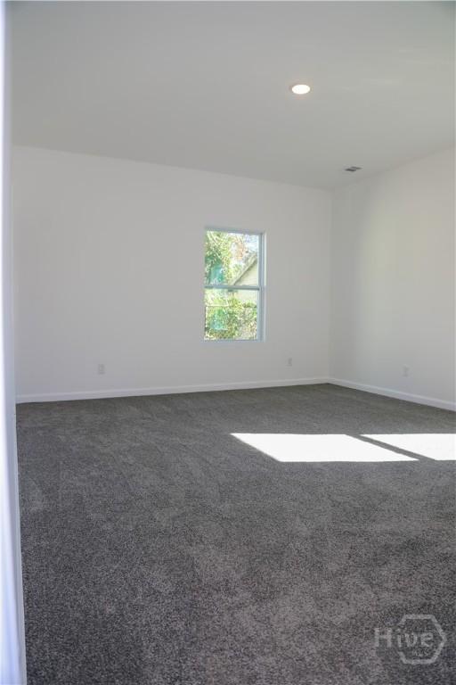 238 Millen St, Savannah, GA 31415 - spare room with dark colored carpet and recessed lighting