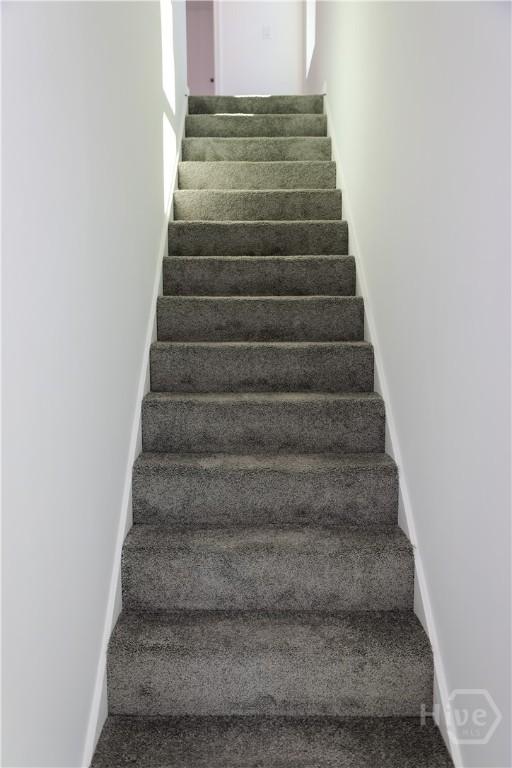 238 Millen St, Savannah, GA 31415 - stairs with baseboards