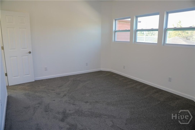 238 Millen St, Savannah, GA 31415 - empty room featuring dark carpet and baseboards