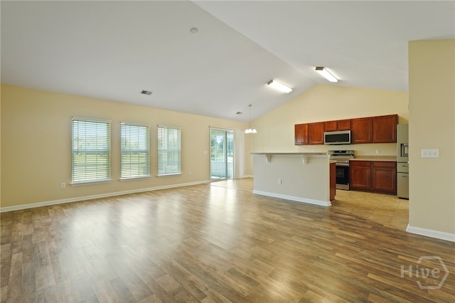 31 Cottingham Way, Pooler, GA 31322 - unfurnished living room featuring light wood finished floors and high vaulted ceiling