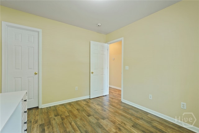 31 Cottingham Way, Pooler, GA 31322 - unfurnished bedroom with dark wood-style floors and baseboards