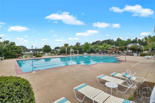 31 Cottingham Way, Pooler, GA 31322 - community pool with a patio area and view of scattered trees