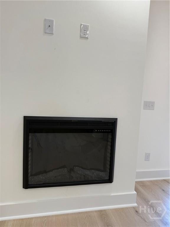 2310 Coakley St, Savannah, GA 31404 - detailed view of a glass covered fireplace and wood finished floors