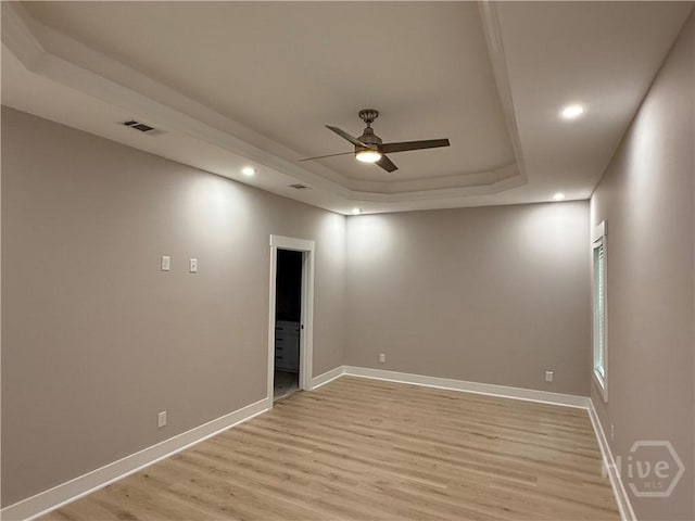 2310 Coakley St, Savannah, GA 31404 - empty room featuring a raised ceiling, ceiling fan, light wood finished floors, and recessed lighting
